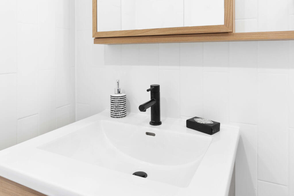 7329East132ndStreetBronxNY104547print Sink and mirror in a Bridgeline unit's bathroom